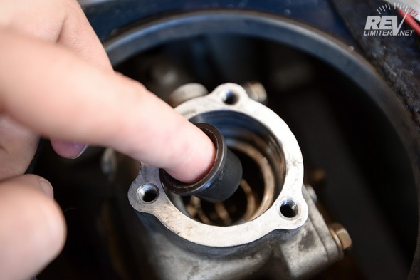 Use a fingertip to lower into place the Delrin shifter tip bushing. 