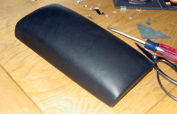 Front edge of smooth, leather padded armrest